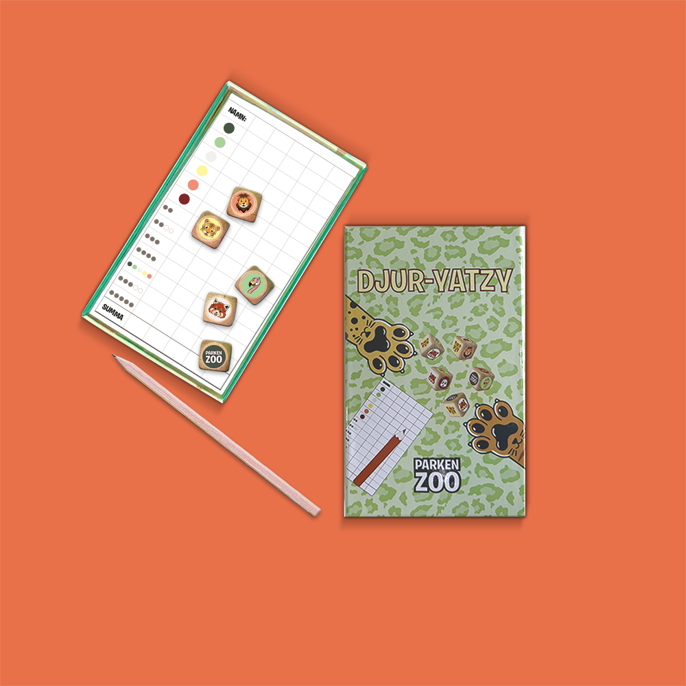 Färgglatt anteckningsblock med penna, med texten Djur-Yatzy och Parken Zoo-logga på omslaget